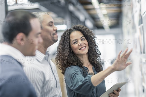 Business people using digital tablet in office