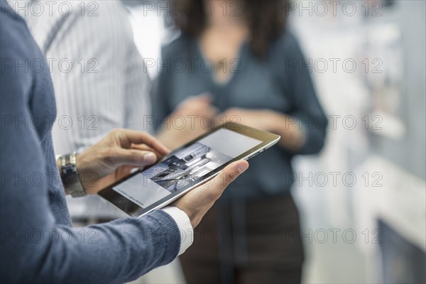 Businessman using digital tablet in office