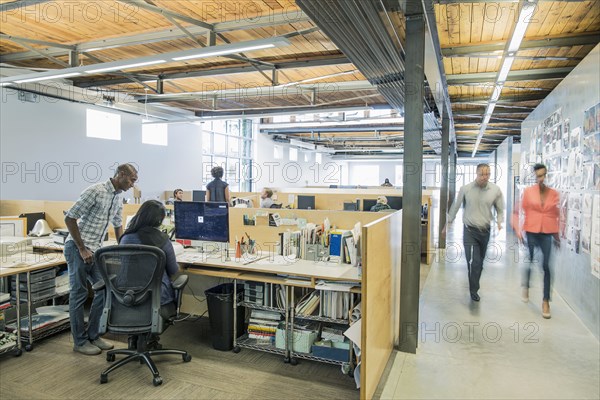 Blurred view of business people walking in office