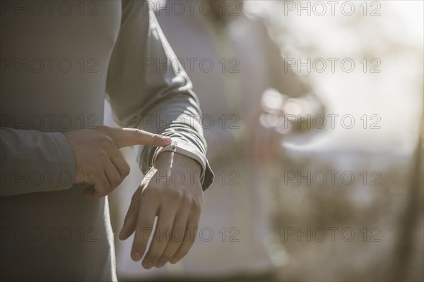 Close up of athlete checking sports watch