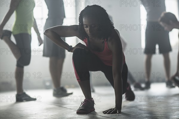 Athlete stretching in gym
