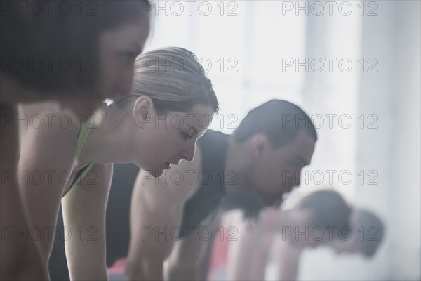 Close up of athletes looking down