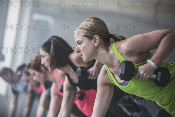 Athletes doing push-ups and lifting weights