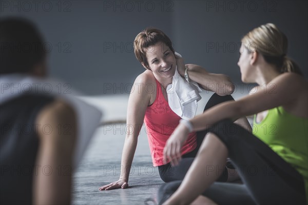 Athletes resting on floor