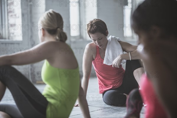 Athletes resting on floor