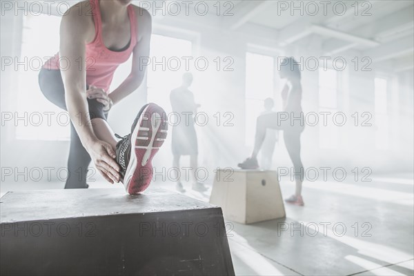 Athlete stretching in gym