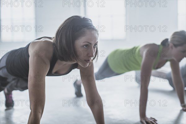 Close up of athlete doing push-ups in gym