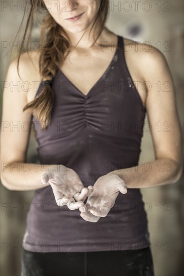 Close up of chalky hands of athlete in gym