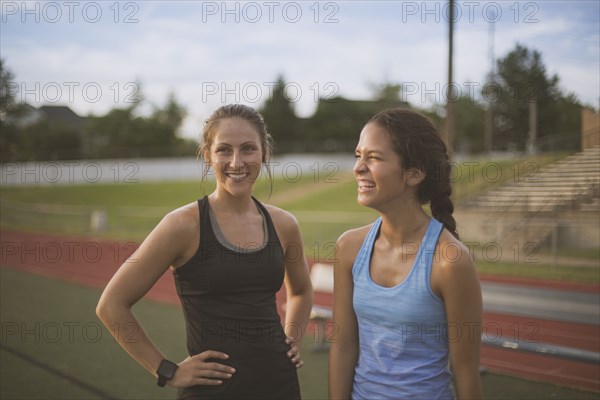 Athletes standing on sports field