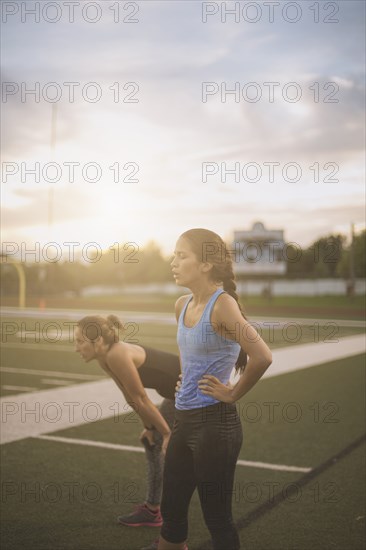 Athletes resting on sports field