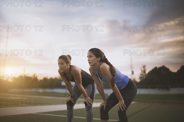 Athletes resting on sports field