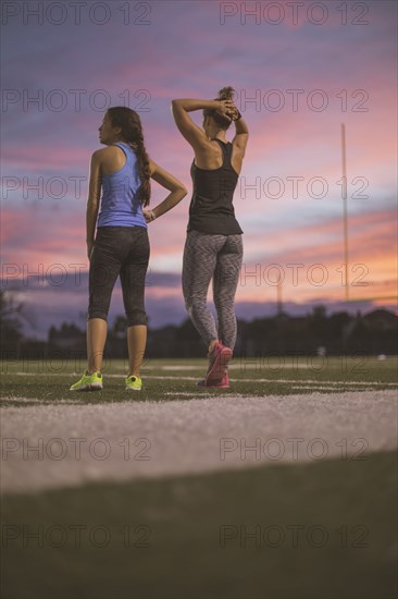 Athletes resting on sports field