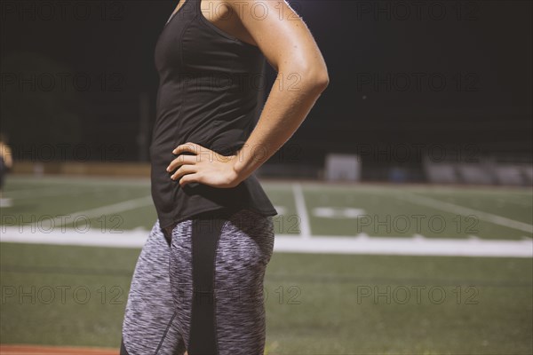Caucasian athlete standing on sports field