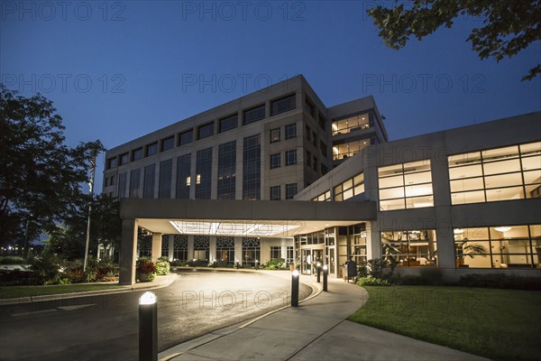 Illuminated driveway of hospital at night