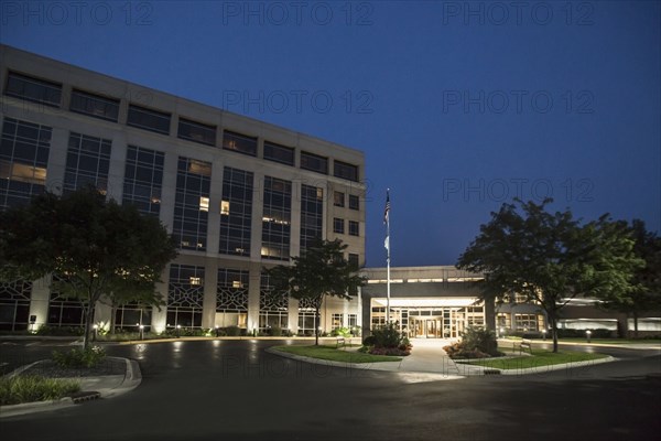 Illuminated driveway of hospital at night