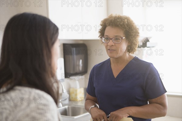 Nurse talking to patient in hospital