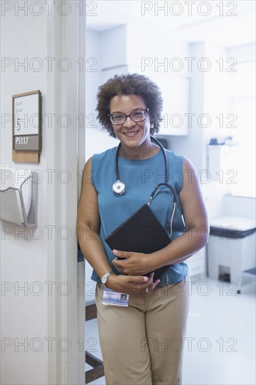 African American doctor holding digital tablet