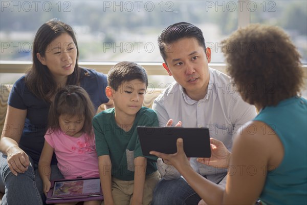 Doctor and patients using digital tablet