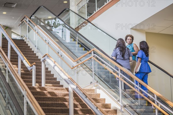 Nurses and doctor on hospital steps