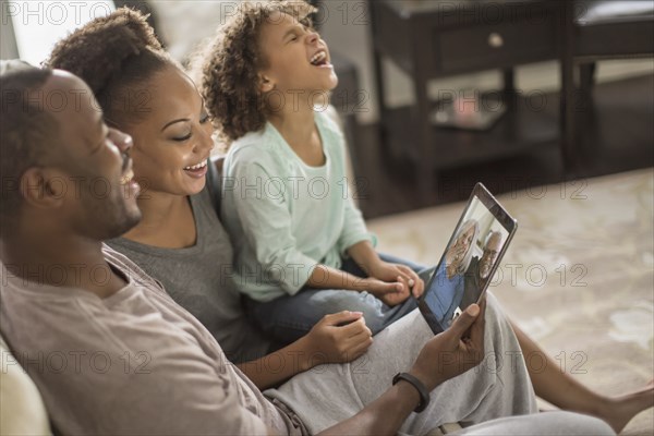 Family video chatting with digital tablet