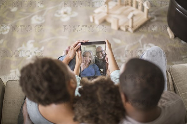 Family video chatting with digital tablet