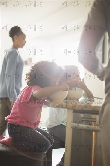 Family eating in kitchen