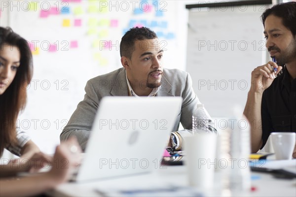 Business people talking in office meeting