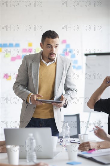 Businessman talking in office meeting