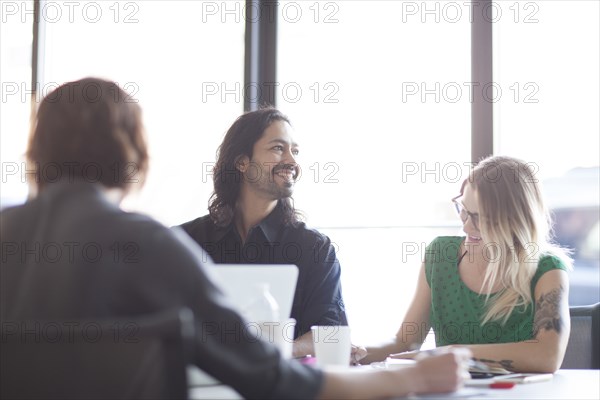 Business people talking in office meeting