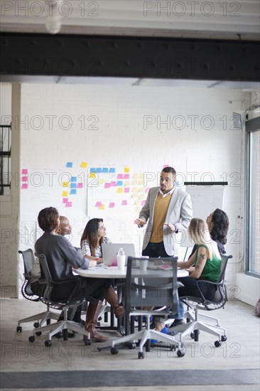 Business people talking in office meeting