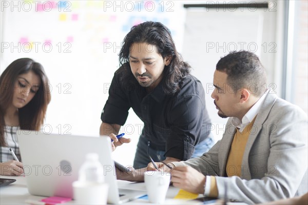 Business people talking in office meeting