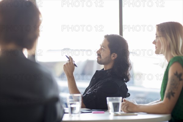 Business people talking in office meeting