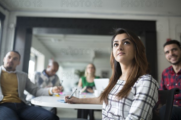 Business people listening in office meeting