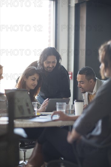 Business people using digital tablet in office