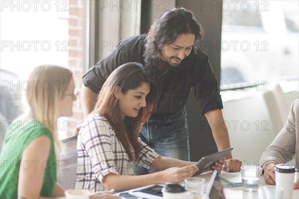 Business people using digital tablet in office