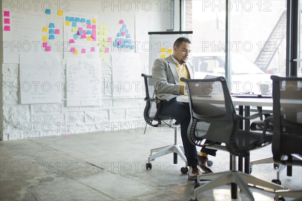 Businessman using digital tablet in office