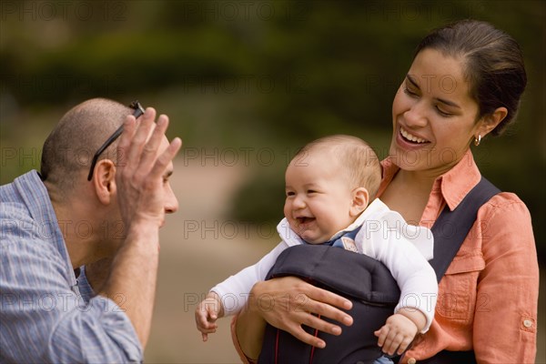 Hispanic family with baby in park