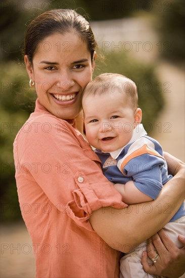 Hispanic mother holding baby