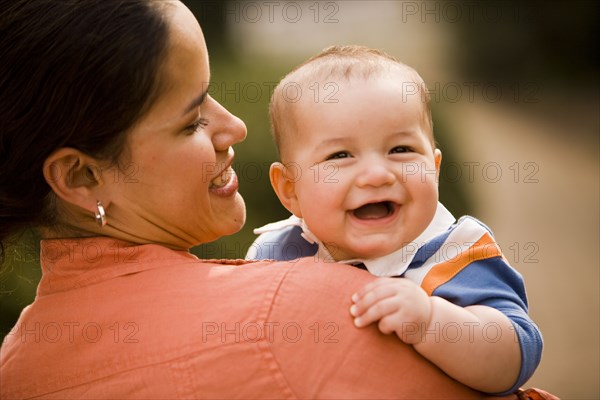 Hispanic mother holding baby