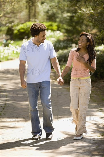 African American couple holding hands