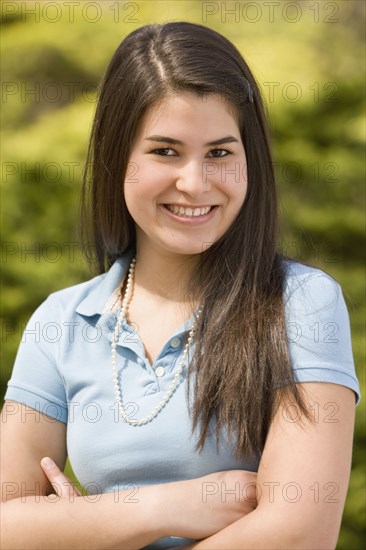 Hispanic girl with arms crossed