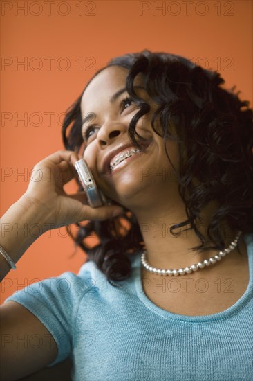 African woman talking on cell phone