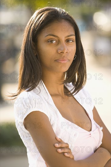 African teenaged girl with arms crossed