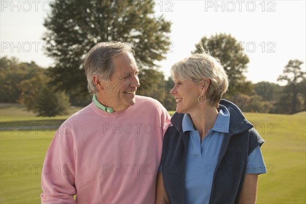 Couple standing together outdoors