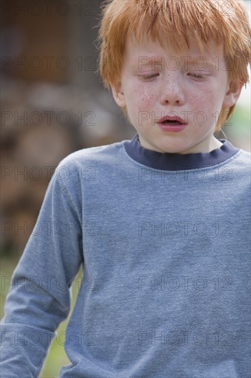 Caucasian boy crying