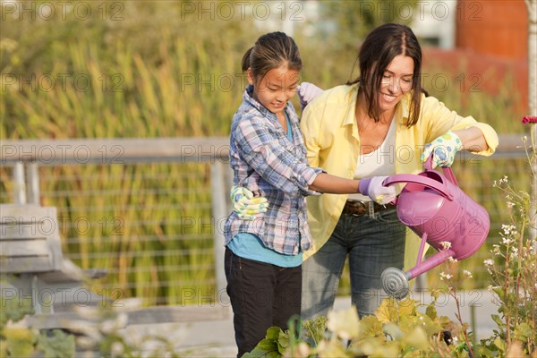 Japanese mother and daughter gardening together