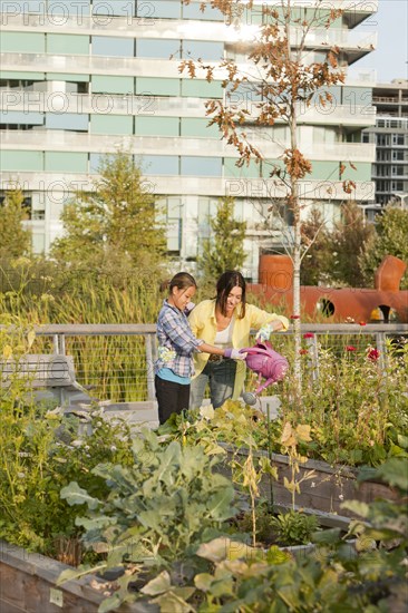 Japanese mother and daughter gardening together