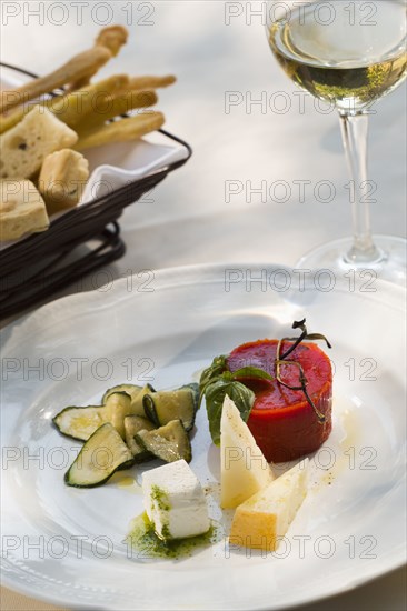 Italian cheese plate with tomato aspic