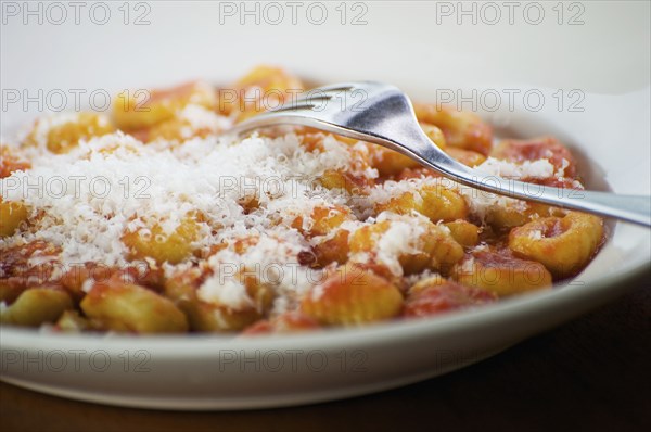 Italian gnocchi with parmesan cheese and tomato sauce