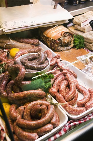 Close up of raw sausage in display case